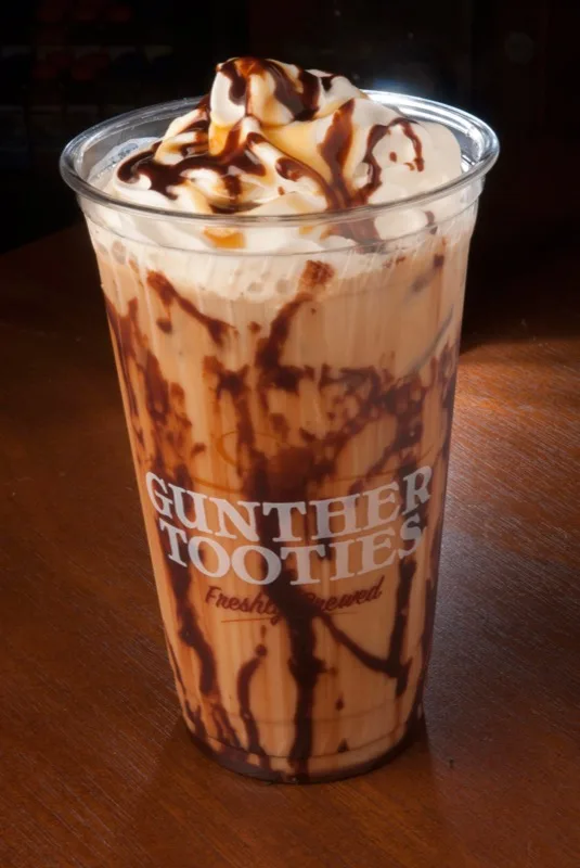 Iced frozen coffee drink topped with whipped cream